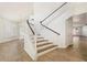 Bright staircase with white railings and wood steps leading to the upper level at 1216 E Rocky Slope Dr, Phoenix, AZ 85048
