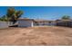 Backyard with detached structure and fencing at 1466 E Nielson Ave, Mesa, AZ 85204