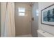 Bright bathroom featuring tiled shower and neutral color palette at 1466 E Nielson Ave, Mesa, AZ 85204