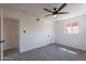 Bedroom with plush carpet and a view to the adjacent room at 1466 E Nielson Ave, Mesa, AZ 85204