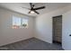 Bedroom featuring closet, modern ceiling fan, and two windows at 1466 E Nielson Ave, Mesa, AZ 85204