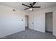 Neutral bedroom featuring carpet, a ceiling fan, and a closet space at 1466 E Nielson Ave, Mesa, AZ 85204