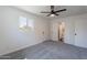 Bright bedroom with plush carpet and an ensuite bathroom at 1466 E Nielson Ave, Mesa, AZ 85204