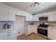 Bright kitchen showcasing white cabinets, subway tile backsplash, and stainless steel appliances at 1466 E Nielson Ave, Mesa, AZ 85204
