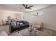 Bright living room featuring neutral tones, stylish furnishings, and a view into the dining area at 1466 E Nielson Ave, Mesa, AZ 85204