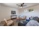 Inviting living room featuring neutral furniture, a ceiling fan, and a view from the window at 1466 E Nielson Ave, Mesa, AZ 85204