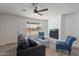 Comfortable living room with a cozy seating area and natural light from a large window at 1466 E Nielson Ave, Mesa, AZ 85204