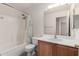 Bathroom featuring a tub/shower combo and a single sink vanity at 14936 W Maui Ln, Surprise, AZ 85379