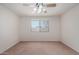 Bedroom with neutral walls and carpet, and a ceiling fan at 14936 W Maui Ln, Surprise, AZ 85379