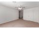 Carpeted bedroom features a ceiling fan and neutral walls at 14936 W Maui Ln, Surprise, AZ 85379