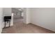 Carpeted bedroom showcasing neutral walls and a view into the living area at 14936 W Maui Ln, Surprise, AZ 85379