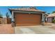 Single-Gathering home featuring a two-car garage, desert landscaping, and a cozy exterior at 14936 W Maui Ln, Surprise, AZ 85379
