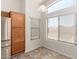 Eat-in kitchen showcasing wood cabinets and a large window with lots of light at 14936 W Maui Ln, Surprise, AZ 85379