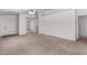 Spacious living room featuring plush carpeting, neutral paint, and a welcoming entrance at 14936 W Maui Ln, Surprise, AZ 85379