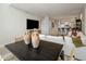 Open-concept living space blending a dining area and living room with stylish modern decor at 15215 N Kierland Blvd # 101, Scottsdale, AZ 85254