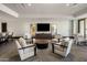 Bright community lounge area with modern furnishings, entertainment center, and comfortable seating arrangement at 15215 N Kierland Blvd # 101, Scottsdale, AZ 85254