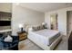 Bright bedroom with a large bed, stylish decor, and ensuite bathroom at 15215 N Kierland Blvd # 101, Scottsdale, AZ 85254