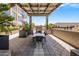 An upper level patio with outdoor seating, a fireplace, and views at 15215 N Kierland Blvd # 101, Scottsdale, AZ 85254