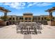 A rooftop deck with outdoor seating, a water feature, and lush greenery at 15215 N Kierland Blvd # 101, Scottsdale, AZ 85254