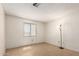 Bedroom featuring a window with security bars and bare walls at 1602 N 73Rd Dr, Phoenix, AZ 85035