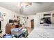 Bedroom with a ceiling fan, a bed, a closet with sliding doors, and a view to an adjacent room at 1602 N 73Rd Dr, Phoenix, AZ 85035