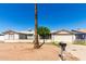 Modest single story home with a front yard and a desert landscape at 1602 N 73Rd Dr, Phoenix, AZ 85035