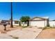 Modest single story home with a desert landscape, and a single car garage at 1602 N 73Rd Dr, Phoenix, AZ 85035