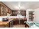 A view of the kitchen featuring outdated cabinets and appliances at 1602 N 73Rd Dr, Phoenix, AZ 85035