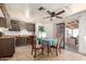 A view of the kitchen featuring outdated cabinets and dining table with chairs at 1602 N 73Rd Dr, Phoenix, AZ 85035