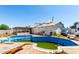 Backyard view of in-ground pool and a house with a covered patio area at 1602 N 73Rd Dr, Phoenix, AZ 85035