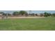 Community baseball field with green grass and backstop at 16029 W Ocotillo Ln, Surprise, AZ 85374