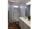 Secondary bathroom with a shower and double sink vanity at 16029 W Ocotillo Ln, Surprise, AZ 85374