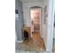 Hallway view leading to a modern half bathroom with stylish decor at 16029 W Ocotillo Ln, Surprise, AZ 85374