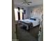 Bright bedroom with modern decor, ceiling fan, window and white bed set at 16029 W Ocotillo Ln, Surprise, AZ 85374
