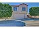 Charming two-story home with a two-car garage and well-maintained landscaping at 16029 W Ocotillo Ln, Surprise, AZ 85374