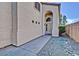 Inviting front entry featuring an arched entryway and well-maintained landscaping at 16029 W Ocotillo Ln, Surprise, AZ 85374