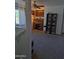 Cozy home office with a ceiling fan, desk and shelving at 16029 W Ocotillo Ln, Surprise, AZ 85374