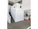 Bright living room with stairway and partial view of the kitchen and island at 16029 W Ocotillo Ln, Surprise, AZ 85374