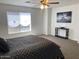 Well-lit main bedroom with a ceiling fan and neutral decor at 16029 W Ocotillo Ln, Surprise, AZ 85374