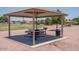 Park pavilion with picnic tables, grill, and garbage can at 16029 W Ocotillo Ln, Surprise, AZ 85374