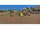 Community playground with a slide and climbing structure at 16029 W Ocotillo Ln, Surprise, AZ 85374