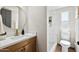 Bathroom featuring a modern vanity and a tiled shower at 16523 N Queen Esther Dr, Surprise, AZ 85378