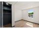 Bedroom featuring a spacious closet with natural light at 16523 N Queen Esther Dr, Surprise, AZ 85378