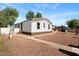 A single-story home with a well-maintained yard at 16523 N Queen Esther Dr, Surprise, AZ 85378