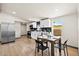 Bright kitchen with stainless steel appliances and sleek cabinetry, open to the dining space at 16523 N Queen Esther Dr, Surprise, AZ 85378