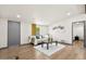 Inviting living room featuring hardwood floors and a view to a connected bedroom at 16523 N Queen Esther Dr, Surprise, AZ 85378