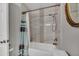 Full bath with shower and tub features neutral wall colors and decorative tile at 18035 N 29Th Dr, Phoenix, AZ 85053