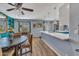 Bright dining area flows into kitchen with white quartz countertops at 18035 N 29Th Dr, Phoenix, AZ 85053