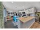 Contemporary open kitchen with stainless steel appliances, a bright blue island, and pendant lighting at 18035 N 29Th Dr, Phoenix, AZ 85053
