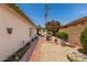 Private backyard with a brick patio and desert landscaping, creating a serene outdoor space at 19546 N 53Rd Ave, Glendale, AZ 85308